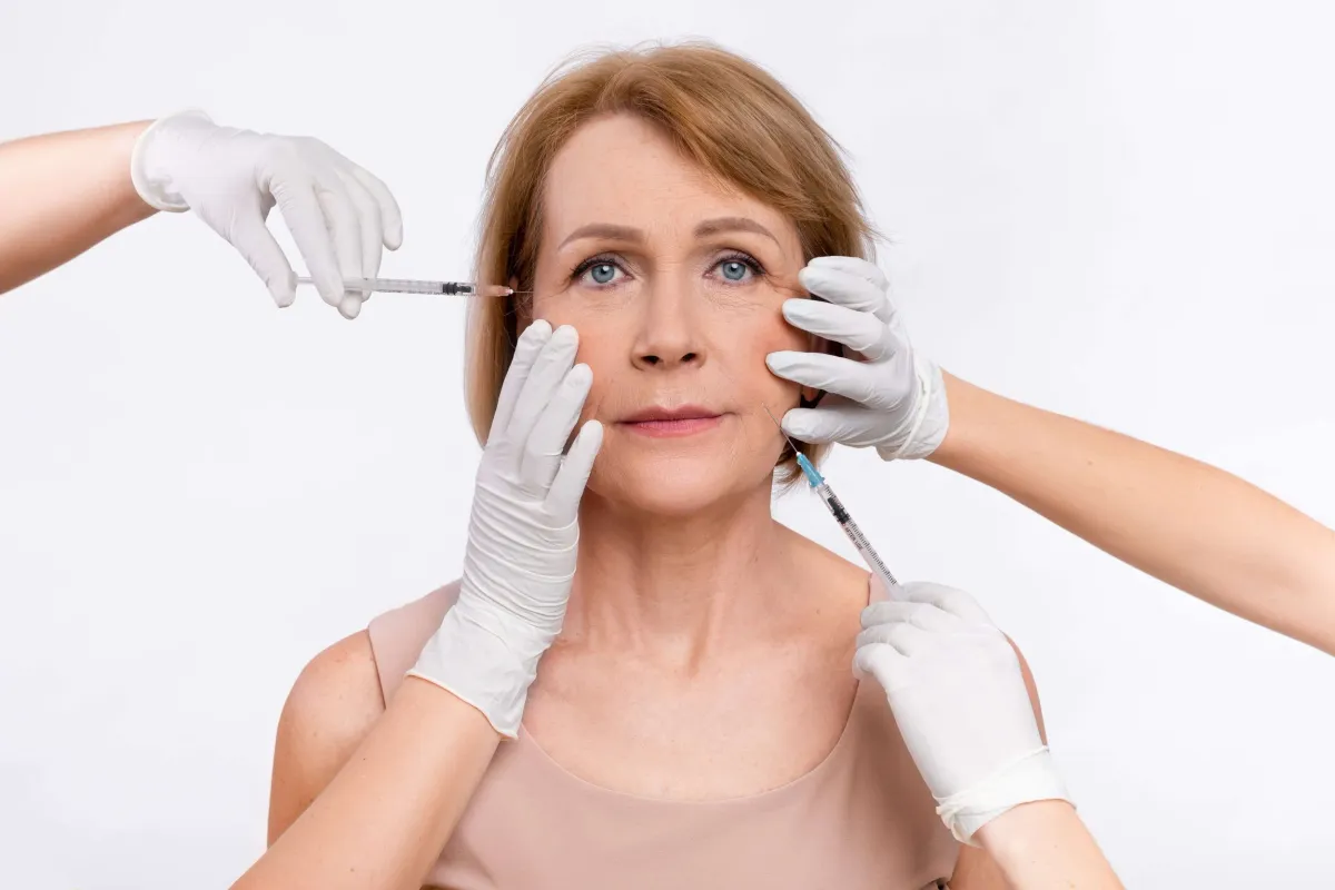 Woman getting injections on her face as a facelift alternative