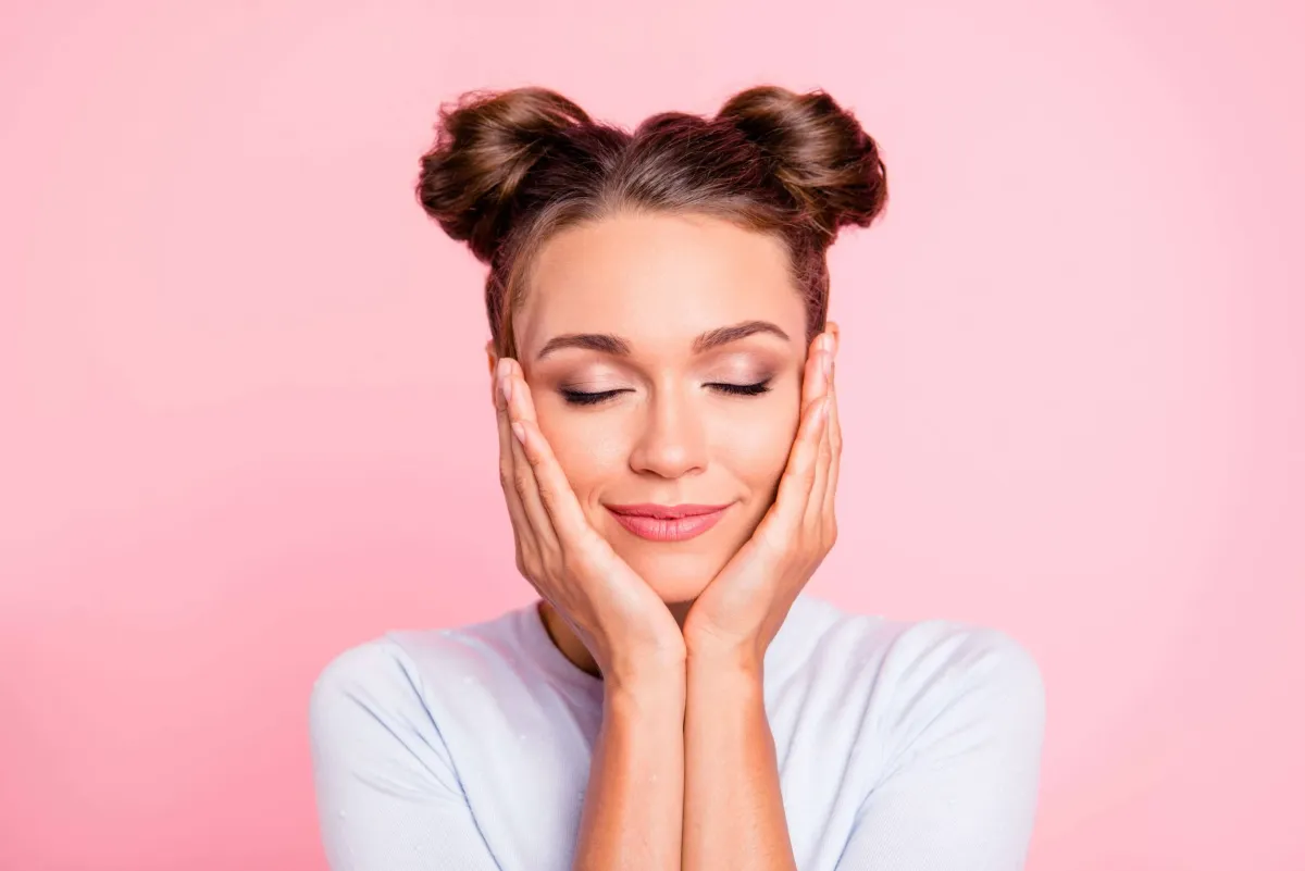 Close-up of microneedling device creating micro-channels in skin for collagen stimulation